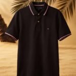 Polo Tommy Wicking De Corte Regular color Negro.